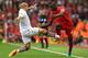 LIVERPOOL, ENGLAND - SEPTEMBER 13: Mario Balotelli of Liverpool is tackled from Alan Hutton of Aston Villa during the Barclays Premier League match between Liverpool and Aston Villa at Anfield on September 13, 2014 in Liverpool, England. (Photo by Alex