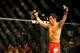 Sep 27, 2014; Las Vegas, NV, USA; Dominick Cruz celebrates his knockout victory in the first round over Takeya Mizugaki during a bantamweight fight in UFC 178 at MGM Grand Garden Arena. Mandatory Credit: Stephen R. Sylvanie-USA TODAY Sports