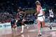 Alvin Robertson brings the ball upcourt against Larry Bird and the Celtics.