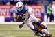 INDIANAPOLIS, IN - JANUARY 04: Donte Moncrief #10 of the Indianapolis Colts is tackled by Terence Newman #23 of the Cincinnati Bengals in the second half during their AFC Wild Card game at Lucas Oil Stadium on January 4, 2015 in Indianapolis, Indiana. (