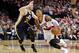 Feb 3, 2015; Portland, OR, USA; Portland Trail Blazers guard Damian Lillard (0) drives past Utah Jazz forward Gordon Hayward (20) during the fourth quarter at the Moda Center. Mandatory Credit: Craig Mitchelldyer-USA TODAY Sports