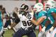 MIAMI GARDENS, FL - AUGUST 28: Defensive end Michael Sam #96 of the St. Louis Rams tries to elude Nate Garner #75 of the Miami Dolphins in the second quarter at Sun Life Stadium on August 28, 2014 in Miami Gardens, Florida. (Photo by Marc Serota/Getty I