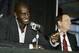 MINNEAPOLIS - OCTOBER 1: Kevin Garnett #21 of the Minnesota Timberwolves gestures to a member of the media while team owner Glen Taylor enjoys the moment during the press conference announcing Garnett's contract extension with the Timberwolves on October