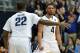 VILLANOVA, PA - FEBRUARY 24: Darrun Hilliard #4 of the Villanova Wildcats celebrates a three point shot as teammate JayVaughn Pinkston #22 congratulates him against the Providence Friars at The Pavilion on February 24, 2015 in Villanova, Pennsylvania. Vil