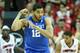LOUISVILLE, KY - DECEMBER 27: Karl-Anthony Towns #12 of the Kentucky Wildcats celebrates by flexing his muscles during the game against the Louisville Cardinals at KFC YUM! Center on December 27, 2014 in Louisville, Kentucky. Kentucky won 58-50. (Phot