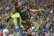 Nov 30, 2014; Seattle, WA, USA; Seattle Sounders FC forward Obafemi Martins (9) goes for a header with Los Angeles Galaxy defender Omar Gonzalez (4) during the second half of the Western Conference Championship at CenturyLink Field. Mandatory Credit: Joe