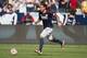 Dec 7, 2014; Los Angeles, CA, USA; New England Revolution midfielder Jermaine Jones (13) dribbles the soccer ball during the first half in the 2014 MLS Cup final against the Los Angeles Galaxy at Stubhub Center. Mandatory Credit: Kyle Terada-USA TODAY Spo