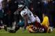 LANDOVER, MD - DECEMBER 20: Running back LeSean McCoy #25 of the Philadelphia Eagles is tackled by nose tackle Barry Cofield #96 of the Washington Redskins in the first quarter of a game at FedExField on December 20, 2014 in Landover, Maryland. (Photo by