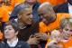 COLLEGE PARK, MD - MARCH 21: (AFP OUT) U.S. President Barack Obama (L) sits beside his brother-in-law Craig Robinson while attending the Green Bay versus Princeton women's college basketball game in the first round of the NCAA tournament, March 21, 2015