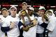 Ruth and teammates celebrate a national team wrestling championship.