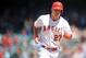 July 26, 2015; Anaheim, CA, USA; Los Angeles Angels center fielder Mike Trout (27) rounds the bases after hitting a grand slam home run in the sixth inning against the Texas Rangers at Angel Stadium of Anaheim. Mandatory Credit: Gary A. Vasquez-USA TODAY