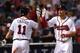 Aug 3, 2015; Atlanta, GA, USA; Atlanta Braves second baseman Jace Peterson (8) high fives with shortstop Daniel Castro (11) after hitting a three run home run against the San Francisco Giants during the sixth inning at Turner Field. Mandatory Credit: Dale