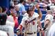 Aug 16, 2015; Atlanta, GA, USA; Atlanta Braves second baseman Jace Peterson (8) gets high fives after scoring the first run of the game against the Arizona Diamondbacks during the fifth inning at Turner Field. Mandatory Credit: Dale Zanine-USA TODAY Sport