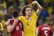 Brazil's defender David Luiz (R) gestures as he consoles Colombia's midfielder James Rodriguez at the end of the quarter-final football match between Brazil and Colombia at the Castelao Stadium in Fortaleza during the 2014 FIFA World Cup on July 4, 2014.