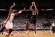 MIAMI, FL - JUNE 10: Boris Diaw #33 of the San Antonio Spurs shoots against Chris Bosh #1 of the Miami Heat during Game Three of the 2014 NBA Finals between the Miami Heat and San Antonio Spurs at the American Airlines Arena on June 10, 2014 in Miami, Flo