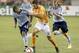 Sep 23, 2015; Houston, TX, USA; Houston Dynamo forward Will Bruin (12) dribbles against Sporting KC defender Kevin Ellis (4) in the second half at BBVA Compass Stadium. Dynamo won 1 to 0. Mandatory Credit: Thomas B. Shea-USA TODAY Sports