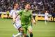 Sep 19, 2015; Vancouver, British Columbia, CAN; Vancouver Whitecaps forward Octavio Rivero (29) battles for the ball against Seattle Sounders defender Zach Scott (20) during the second half at BC Place. The Seattle Sounders won 3-0. Mandatory Credit: Anne