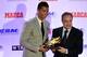 Real Madrid's Portuguese forward Cristiano Ronaldo (L) receives his fourth European Golden Shoe from Real Madrid's president Florentino Perez, on October 13, 2015 in Madrid. Cristiano, who ended the season with 48 goals from 35 appearances, won the Golden