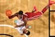Once forced to sneak out of his house to play basketball, Hield now dazzles on national TV, scoring 30 points in Oklahoma's season-opening win over Memphis.