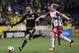 Nov 22, 2015; Columbus, OH, USA; Columbus Crew forward Justin Meram (9) plays the ball past New York Red Bulls midfielder Dax McCarty (11) in the second half of leg one of the Eastern Conference championship at Mapfre Stadium. The Crew won 2-0. Mandatory