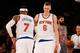 NEW YORK, NY - DECEMBER 19: Kristaps Porzingis #6 and Carmelo Anthony #7 of the New York Knicks looks on against the Chicago Bulls at Madison Square Garden on December 19, 2015 in New York City. Knicks defeated the Bulls 107-91. NOTE TO USER: User expre