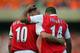 LONDON, UNITED KINGDOM: Thierry Henry (R) of Arsenal celebrates scoring against Ajax with teammate Dennis Bergkamp during a pre season 'Dennis Bergkamp' testimonial match at Emirates stadium in north London, 22 July 2006. The match played in honour of Ar