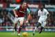 LONDON, ENGLAND - JANUARY 02: Andy Carroll of West Ham United and Mamadou Sakho of Liverpool compete for the ball during the Barclays Premier League match between West Ham United and Liverpool at Boleyn Ground on January 2, 2016 in London, England. (Phot