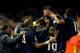 Real Madrid's Welsh forward Gareth Bale (C) celebrates with teammates after scoring during the Spanish league football match Valencia CF vs Real Madrid CF at the Mestalla stadium in Valencia on January 3, 2016. AFP PHOTO/ JOSE JORDAN / AFP / JOSE JORDAN