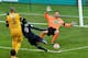 Paris Saint-Germain's French forward Jean-Kevin Augustin (C) is about to kick the ball in front of Wasquehal's goalkeeper Romain Samson (R) during the French Cup football match Wasquehal (CFA) vs PSG (L1) on January 3, 2016 at the Stadium Lille Métropole