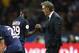 PARIS - AUGUST 16: Head coach of PSG Laurent Blanc greets Jean-Kevin Augustin of PSG during the French Ligue 1 match between Paris Saint-Germain FC (PSG) and GFC Ajaccio (Gazelec Ajaccio) at Parc des Princes stadium on August 16, 2015 in Paris, France. (P