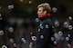 Liverpool's German manager Jurgen Klopp watches through the bubbles during the English Premier League football match between West Ham United and Liverpool at The Boleyn Ground in Upton Park, East London on January 2, 2016. West Ham won the game 2-0. AFP P
