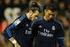 Real Madrid's Welsh forward Gareth Bale (L) and Real Madrid's Portuguese forward Cristiano Ronaldo look down during the Spanish league football match Valencia CF vs Real Madrid CF at the Mestalla stadium in Valencia on January 3, 2016. AFP PHOTO/ JOSE J