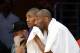 LOS ANGELES, CA - NOVEMBER 22: Kobe Bryant #24 of the Los Angeles Lakers wipes his face as teammate Metta World Peace #37 follows the action during second half of the basketball game against the Portland Trail Blazers at Staples Center November 22, 2015 i