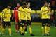 Dortmund players hanging their hands after a defeat against PAOK in the group stage of the Europa League.