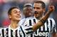 Juventus' forward Paulo Dybala from Argentina (L) celebrates after scoring with Juventus' defender Leonardo Bonucci during the Italian Serie A football match Juventus Vs Hellas Verona on January 6, 2016 at the 'Juventus Stadium' in Turin. AFP PHOTO / M
