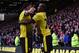 Watford's Nigerian striker Odion Ighalo celebrates with Watford's English striker Troy Deeney (L) after scoring their second goal during the English Premier League football match between Watford and Liverpool at Vicarage Road Stadium in Watford, north of