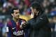 Barcelona's coach Luis Enrique (R) talls with Barcelona's forward Pedro Rodriguez (L) during the Spanish league football match FC Barcelona vs Malaga CF at the Camp Nou stadium in Barcelona on February 21, 2015. AFP PHOTO / LLUIS GENE (Photo credit