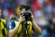 LONDON, ENGLAND - MAY 30: Mesut Oezil of Arsenal uses a photographers camera as he celebrates victory after the FA Cup Final between Aston Villa and Arsenal at Wembley Stadium on May 30, 2015 in London, England. Arsenal beat Aston Villa 4-0. (Photo by C