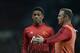 Manchester United's French striker Anthony Martial (L) listens to Manchester United's English striker Wayne Rooney (R) during the warm up before the English Premier League football match between Manchester United and Chelsea at Old Trafford in Manchester,