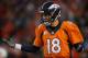DENVER, CO - JANUARY 03: Quarterback Peyton Manning #18 of the Denver Broncos reacts after a one yard touchdown run by C.J. Anderson #22 of the Denver Broncos to take a 14-13 lead over the San Diego Chargers in the third quarter at Sports Authority Field