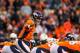 DENVER, CO - JANUARY 3: Quarterback Peyton Manning #18 of the Denver Broncos runs the offense against the San Diego Chargers during a game at Sports Authority Field at Mile High on January 3, 2016 in Denver, Colorado. (Photo by Justin Edmonds/Getty Image