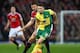 MANCHESTER, ENGLAND - DECEMBER 19: Wes Hoolahan of Norwich City and Michael Carrick of Manchester United compete for the ball during the Barclays Premier League match between Manchester United and Norwich City at Old Trafford on December 19, 2015 in Manch