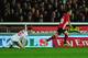 EXETER, ENGLAND - JANUARY 08: Connor Randall of Liverpool looks dejected as Tom Nichols of Exeter City celebrates scoring their opening goal during the Emirates FA Cup third round match between Exeter City and Liverpool at St James Park on January 8, 201