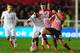 EXETER, ENGLAND - JANUARY 08: Jerome Sinclair of Liverpool holds off Jordan Tillson of Exeter City during the Emirates FA Cup third round match between Exeter City and Liverpool at St James Park on January 8, 2016 in Exeter, England. (Photo by Dan Mulla