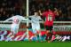 EXETER, ENGLAND - JANUARY 08: Alex Nicholls of Exeter City (14) reacts as Brad Smith of Liverpool (C) celebrates scoring their second goal with Pedro Chirivella (68) during the Emirates FA Cup third round match between Exeter City and Liverpool at St Jam