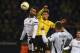 Dortmund's midfielder Adnan Januzaj (C) vies with PAOK´s Giorgos Tzavellas during the UEFA Europa League football match between Borussia Dortmund and PAOK FC at BVB Stadion Dortmund in Dortmund on December 10, 2015. AFP PHOTO / PATRIK STOLLARZ / AFP / PA
