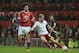 Sheffield United's English-born Scottish defender Jay McEveley (R) plays the ball as Manchester United's Belgian midfielder Marouane Fellaini (L) pressures during the English FA Cup third-round football match between Manchester United and Sheffield United