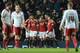 Manchester United's English striker Wayne Rooney (C) celebrates with team-mates after scoring from the penalty spot for the opening goal late during the English FA Cup third-round football match between Manchester United and Sheffield United at Old Traffo