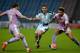 HUDDERSFIELD, ENGLAND - JANUARY 09: Jason Davidson of Huddersfield Town looks to get past Chris Gunter and Danny Williams of Reading during The Emirates FA Cup Third Round between Huddersfield Town and Reading at John Smiths Stadium on January 9, 2016 in