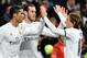 Real Madrid's Welsh forward Gareth Bale (C) is congratulated by Real Madrid's Portuguese forward Cristiano Ronaldo (L) and Real Madrid's Croatian midfielder Luka Modric after scoring during the Spanish league football match Real Madrid CF vs RC Deportivo
